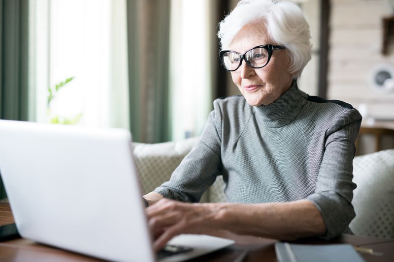 senior woman at laptop computer