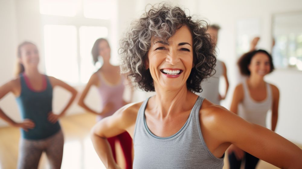 happy retired woman at fitness class